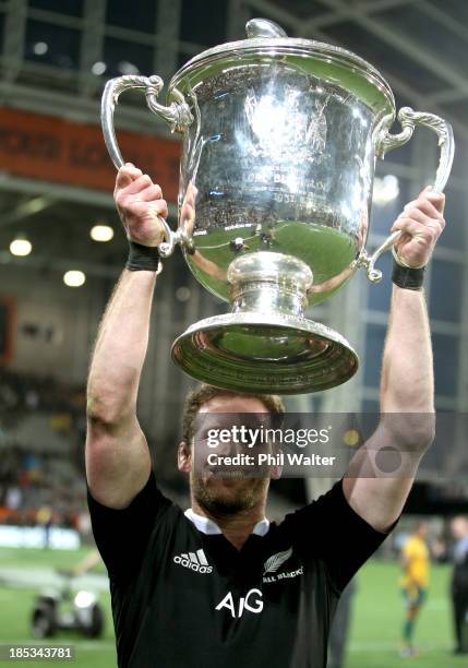 Kieran Read of the All Blacks holds up the Bledisloe Cup following The Rugby Championship match between the New Zealand All Blacks and the Australian...