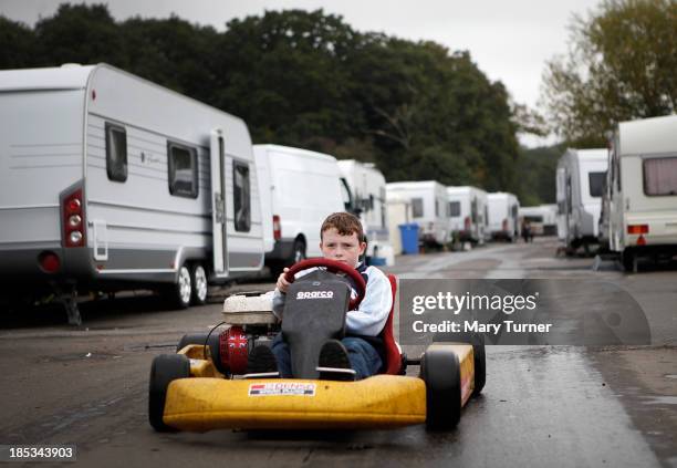 Little boy plays on a racing cart on the road leading up to the the Dale Farm site on October 18, 2013 in Crays Hill, England. Two years on from the...