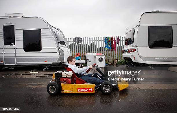 Little boy plays on a racing cart on the road leading up to the the Dale Farm site on October 18, 2013 in Crays Hill, England. Two years on from the...