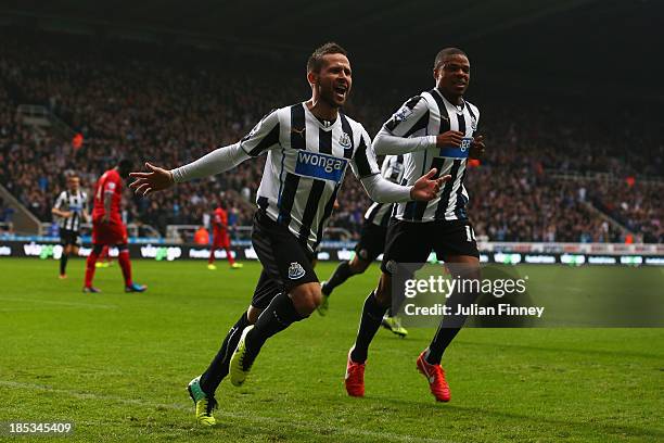 Yohan Cabaye of Newcastle United celebrates scoring their first goal with Loic Remy of Newcastle United during the Barclays Premier League match...