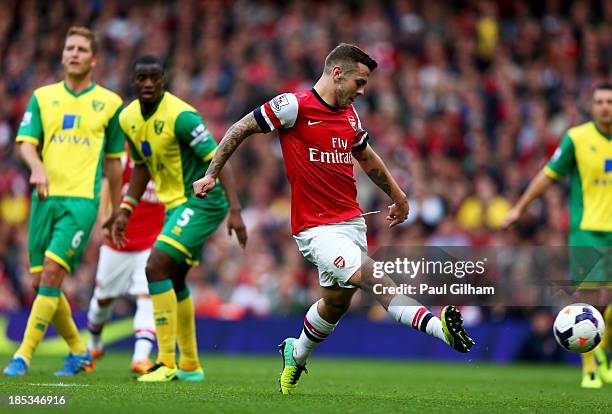 Jack Wilshere of Arsenal scores their first goal during the Barclays Premier League match between Arsenal and Norwich City at Emirates Stadium on...