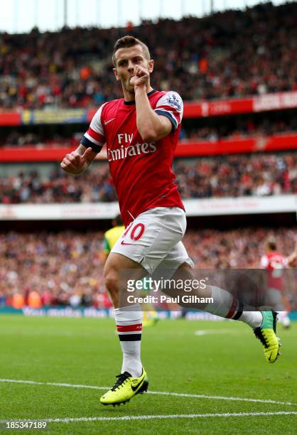 Jack Wilshere of Arsenal celebrates as he scores their first goal during the Barclays Premier League match between Arsenal and Norwich City at...