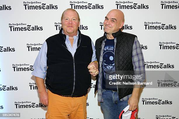 Mario Batali and Michael Symon attend New York Times 'TimesTalks' with celebrity chefs and food personalities at The Times Center on October 19, 2013...