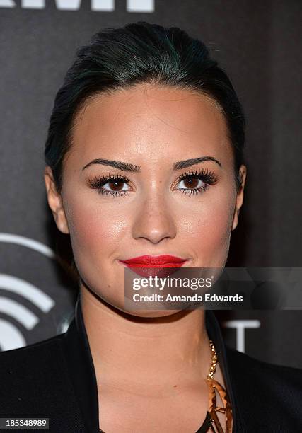 Actress Demi Lovato arrives at the launch of the Redlight Traffic APP at the Dignity Gala at The Beverly Hilton Hotel on October 18, 2013 in Beverly...