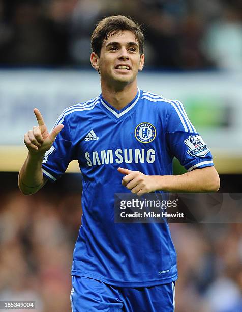 Oscar of Chelsea celebrates scoring his side's third goal during the Barclays Premier League match between Chelsea and Cardiff City at Stamford...