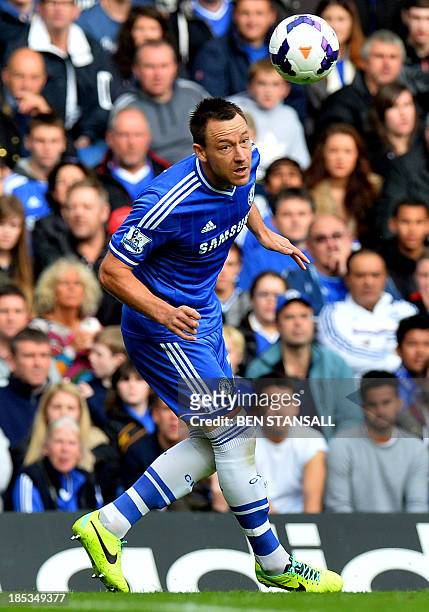 Chelsea's English defender John Terry heads the ball during the English Premier League football match between Chelsea and Cardiff City at Stamford...
