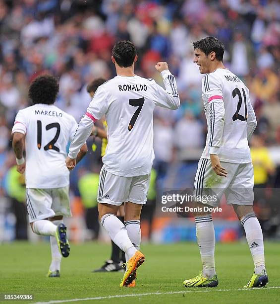 Cristiano Ronaldo of Real Madrid CF celebrates with Alvaro Morata after scoring Real's 2nd goal from the penalty spot during the La Liga match...