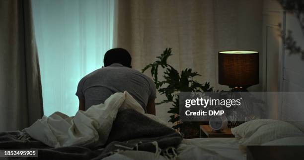 stress, insomnia and back of man on a bed with sleeping problem, anxiety or ptsd trauma in his home. conflict, depression and male person in a bedroom with overthinking crisis, disaster or frustrated - post traumatic stress disorder stock pictures, royalty-free photos & images