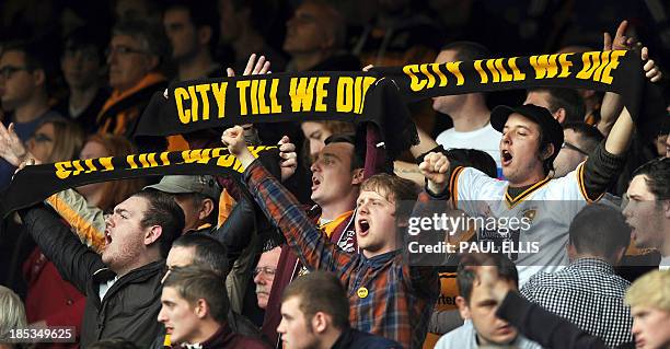 Hull City supporters protest against the changing of the club's name to Hull City Tigers during the English Premier League football match between...
