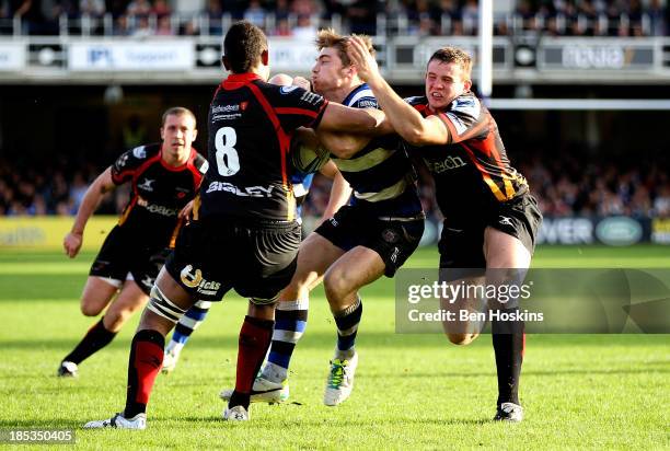 Richard Lane of Bath is tacked by Toby Faletau of Newport during the Amlin Challenge Cup match between Bath and Newport Gwent Dragons at Recreation...