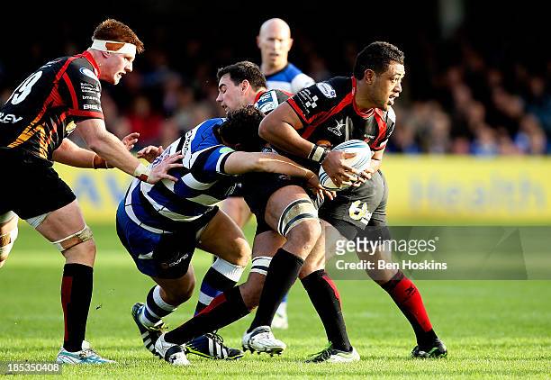 Toby Faletau of Newport is tackled during the Amlin Challenge Cup match between Bath and Newport Gwent Dragons at Recreation Ground on October 19,...
