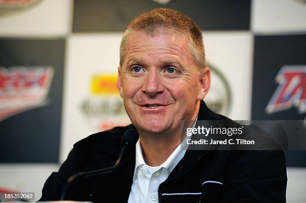 Jeff Burton, driver of the Caterpillar Chevrolet, speaks during a press conference during qualifying for the NASCAR Sprint Cup Series 45th Annual...