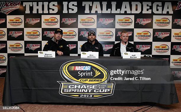 Marcos Ambrose, driver of the DeWalt Ford, Aric Almirola, driver of the Charter Ford, and Jeff Burton, driver of the Caterpillar Chevrolet, speak at...