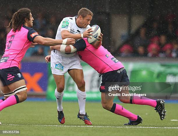 Jonny Wilkinson of Toulon is tackled during the Heineken Cup pool 2 match between Cardiff Blues and Toulon at Cardiff Arms Park on October 19, 2013...