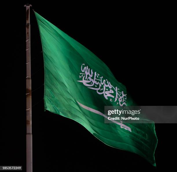 Large flag of the Kingdom of Saudi Arabia is seen flying near Riyadh, Saudi Arabia on 14 December, 2023.