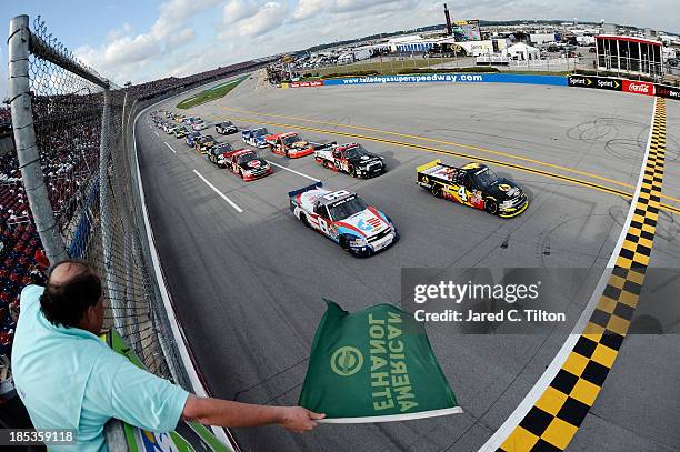 Jeb Burton, driver of the Arrowhead / Kangaroo Express Dodge, and Max Gresham, driver of the Made in USA Chevrolet, lead the field at the start of...