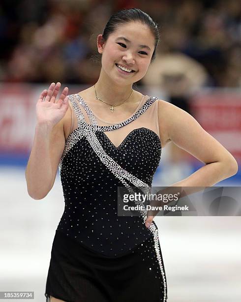 Caroline Zhang of the USA waves to the crowd after performing in the ladies short program of day two at Skate America at Joe Louis Arena on October...