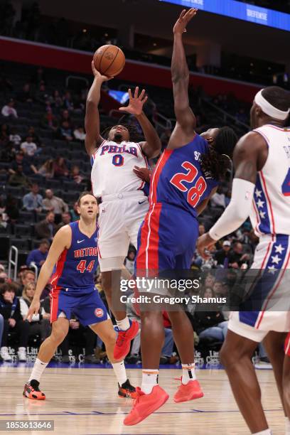 Tyrese Maxey of the Philadelphia 76ers takes a shot over Isaiah Stewart of the Detroit Pistons during the first half at Little Caesars Arena on...