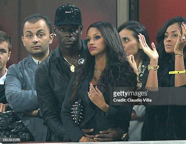 Mario Balotelli of AC Milan and Fanny Neguesha attend the Serie A match between AC Milan and Udinese Calcio at Giuseppe Meazza Stadium on October 19,...