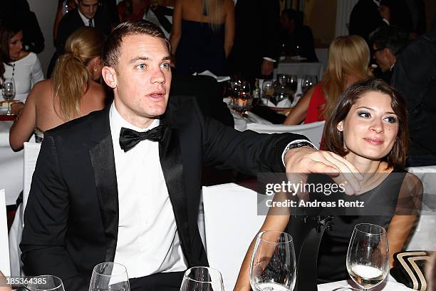 Manuel Neuer and Kathrin Gilch attend the 7th Audi Generation Award 2013 at Hotel Bayerischer Hof on October 19, 2013 in Munich, Germany.