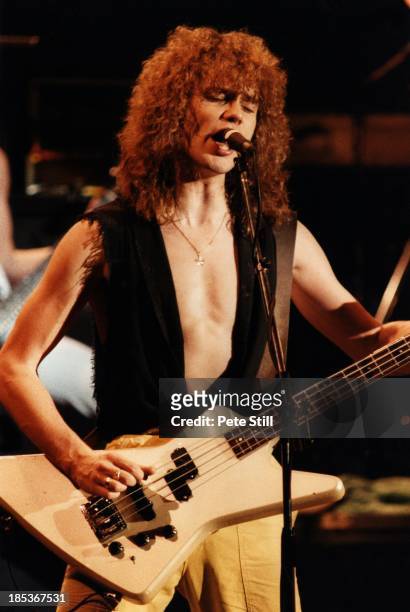 Rick Savage of Def Leppard performs on stage at Hammersmith Odeon, on December 5th, 1983 in London, England.