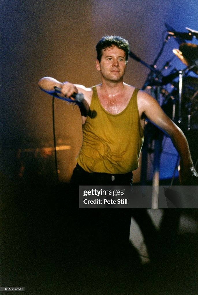 Jim Kerr of Simple Minds performs on stage at Wembley Arena on July