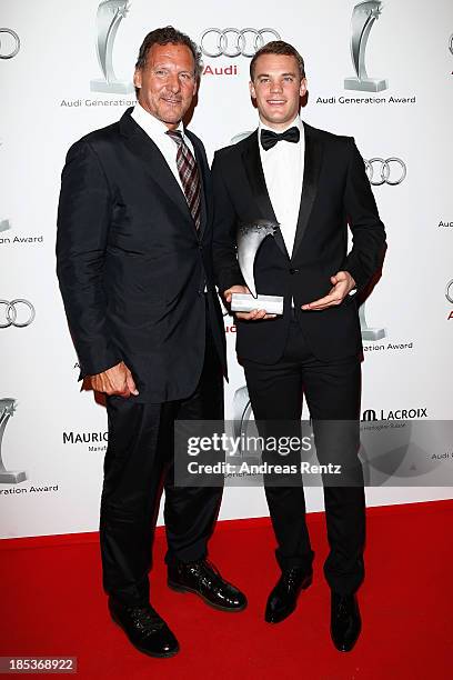 Ralf Moeller and Manuel Neuer with his award attend the 7th Audi Generation Award 2013 at Hotel Bayerischer Hof on October 19, 2013 in Munich,...