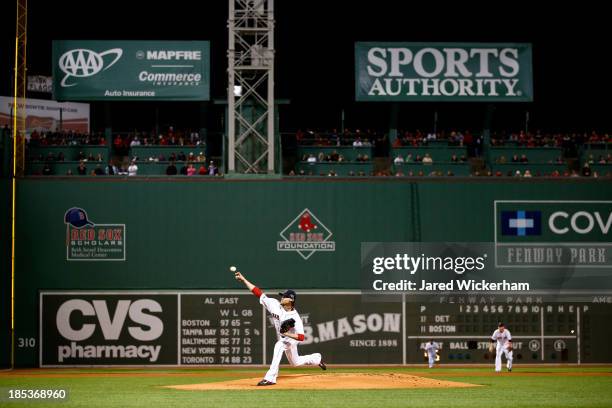 Clay Buchholz of the Boston Red Sox throws a pitch in the first inning against the Detroit Tigers during Game Six of the American League Championship...