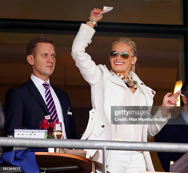 Jeremy Kyle and wife Carla Kyle cheer whilst watching the racing as they attend the QIPCO British Champions Day at Ascot Racecourse on October 19,...