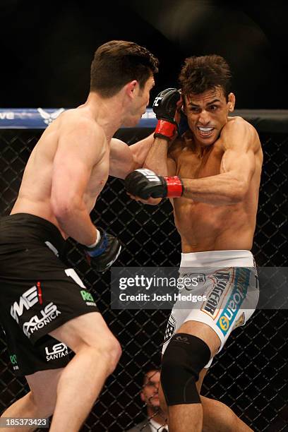 Noons punches George Sotiropoulos in their UFC lightweight bout at the Toyota Center on October 19, 2013 in Houston, Texas.