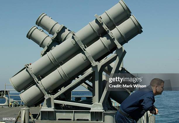 Sailor stands next to a Harpoon Mark 7 missile launcher aboard the USS San Jacinto March 17, 2003. The San Jacinto is a guided missile cruiser that...