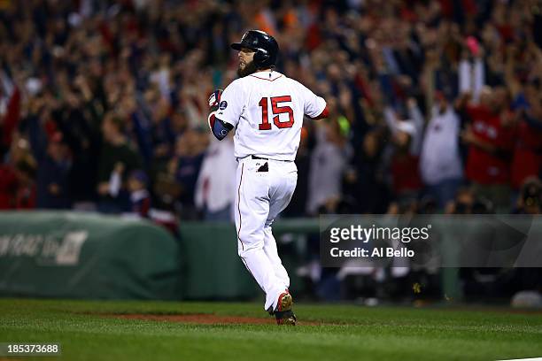Dustin Pedroia of the Boston Red Sox looks on after hitting a ball that was ruled a foul in the third inning against Max Scherzer of the Detroit...