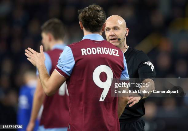 Referee Anthony Taylor speaks to Burnley's Jay Rodriguez during the Premier League match between Burnley FC and Everton FC at Turf Moor on December...