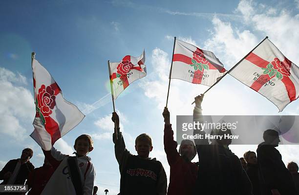 Young England fans wave their flags during the RBS Six Nations Championship match between England and Italy held on March 9, 2003 at Twickenham, in...