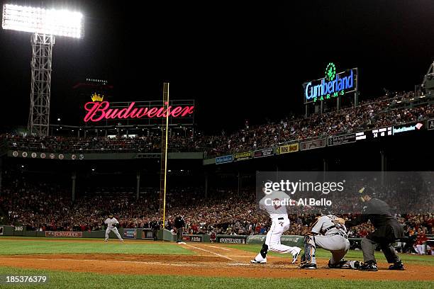 Jacoby Ellsbury of the Boston Red Sox hits single to right against Max Scherzer of the Detroit Tigers to bring home Xander Bogaerts of the Boston Red...