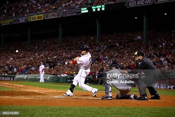 Jacoby Ellsbury of the Boston Red Sox hits single to right against Max Scherzer of the Detroit Tigers to bring home Xander Bogaerts of the Boston Red...