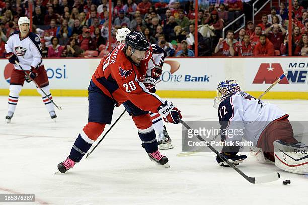 Troy Brouwer of the Washington Capitals scores a goal against the Columbus Blue Jackets in the third period at the Verizon Center on October 19, 2013...