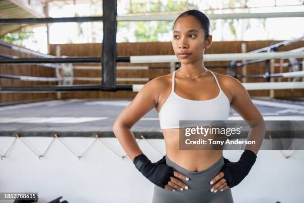 portrait of young woman martial arts fighter at boxing ring - female martial arts stock pictures, royalty-free photos & images