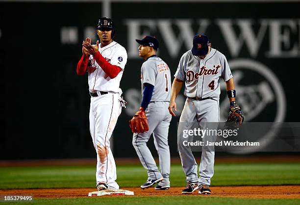 Xander Bogaerts of the Boston Red Sox claps on second base after being called safe in the seventh inning against the Detroit Tigers during Game Six...