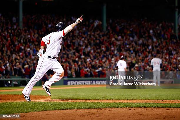 Shane Victorino of the Boston Red Sox celebrates after hitting a grand slam home run against Jose Veras of the Detroit Tigers in the seventh inning...