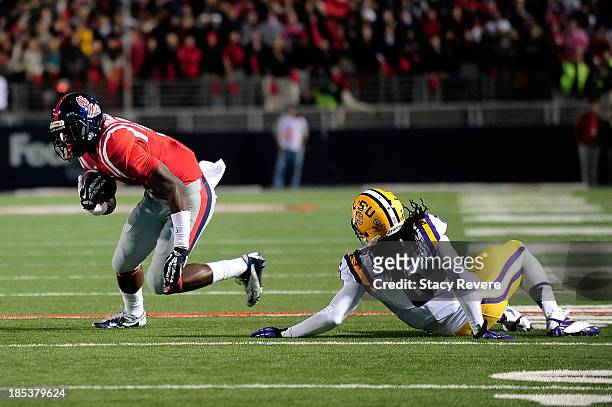 Craig Loston of the LSU Tigers is unable to tackle Laquon Treadwell of the Ole Miss Rebels during a game at Vaught-Hemingway Stadium on October 19,...