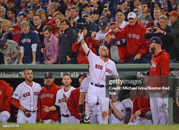 Shane Victorino of the Boston Red Sox acknowledges the crowd after hitting a grand slam against the Detroit Tigers in the seventh inning of Game Six...