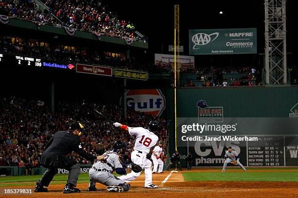 Shane Victorino of the Boston Red Sox hits a grand slam home run against Jose Veras of the Detroit Tigers in the seventh inning during Game Six of...