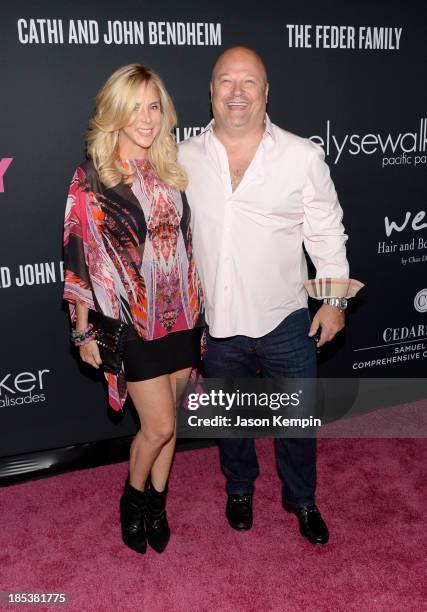 Actor Michael Chiklis and Michelle Chiklis attend Elyse Walker Presents The Pink Party 2013 hosted by Anne Hathaway at Barker Hangar on October 19,...