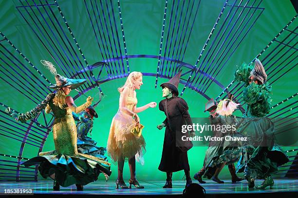 Actresses Cecilia de la Cueva and Danna Paola perform on stage during the musical "Wicked" media call at Teatro Telmex on October 18, 2013 in Mexico...