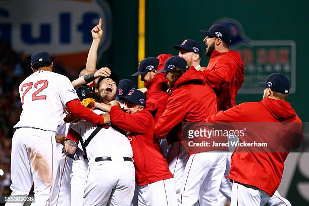 Koji Uehara the Boston Red Sox celebrates with his teammates after defeating the Detroit Tigers in Game Six of the American League Championship...