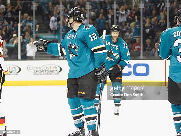Patrick Marleau of the San Jose Sharks celebrates his goal against the Calgary Flames during an NHL game on October 19, 2013 at SAP Center in San...
