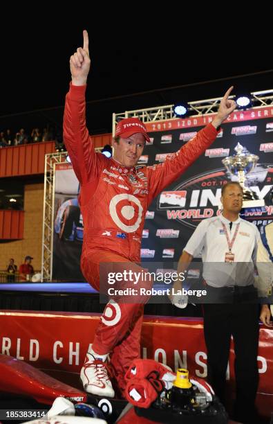 Scott Dixon of New Zealand and driver of the Target Chip Ganassi Racing Dallara Honda, celebrates winning the IZOD IndyCar Series Championship during...