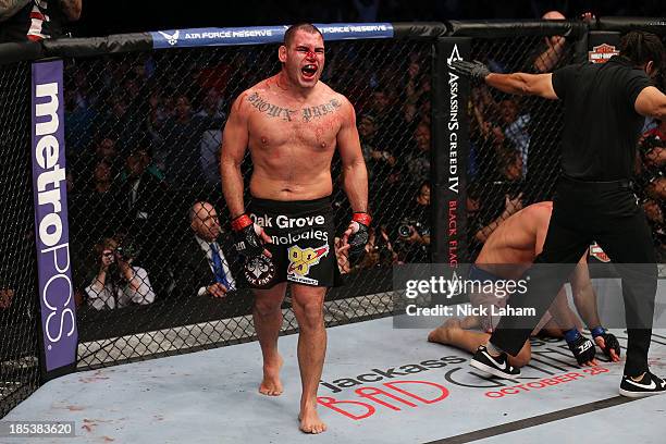 Cain Velasquez celebrates after defeating Junior Dos Santos by TKO after referee Herb Dean calls a stop to the fight in their UFC heavyweight...