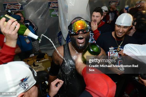 David Ortiz of the Boston Red Sox celebrates in the locker room after defeating the Detroit Tigers and winning the American League Championship...